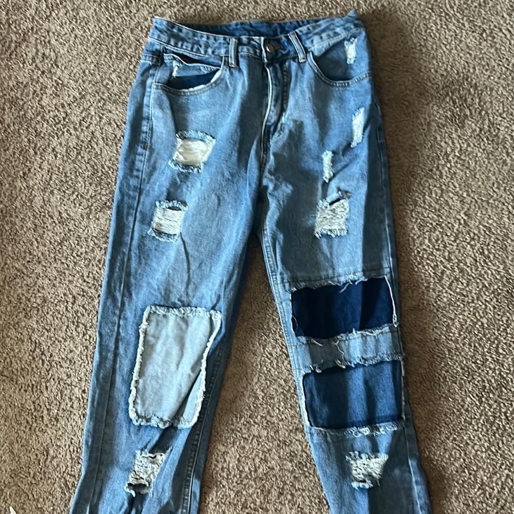 Baggy stitched blue jeans